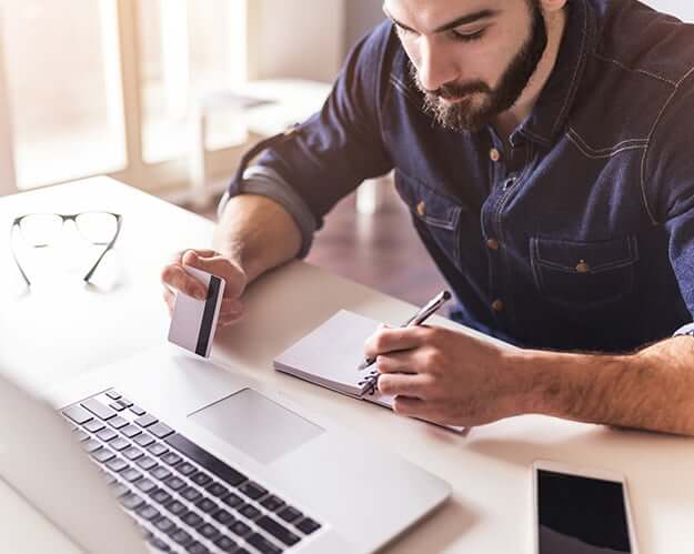 man paying a bill online