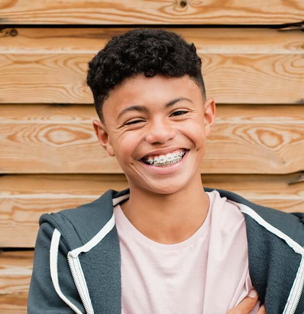 smiling boy with braces