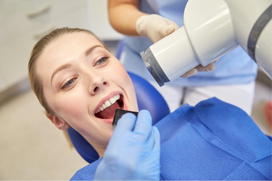 woman in the dentist chair getting digital x-rays