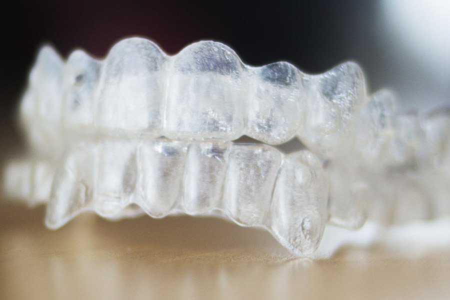 pair of clear aligners to straighten teeth