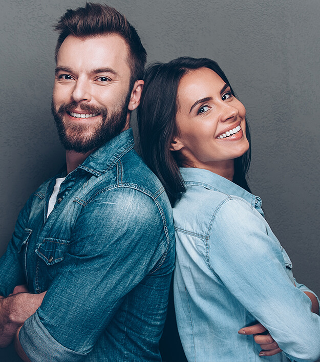 man and woman standing back to back