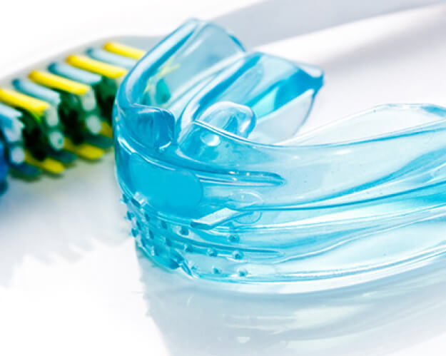 mouthguard with toothbrush