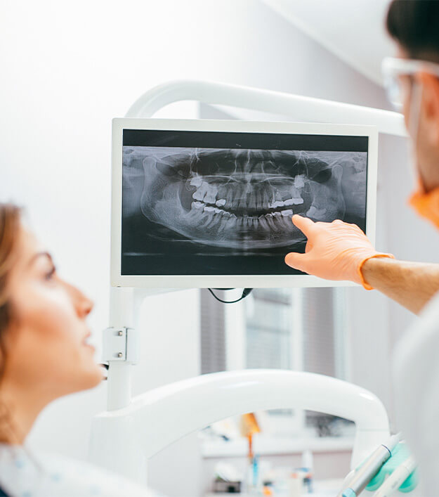 dentist discussing an x-ray with a patient