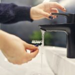 cleaning clear aligners under water with soap